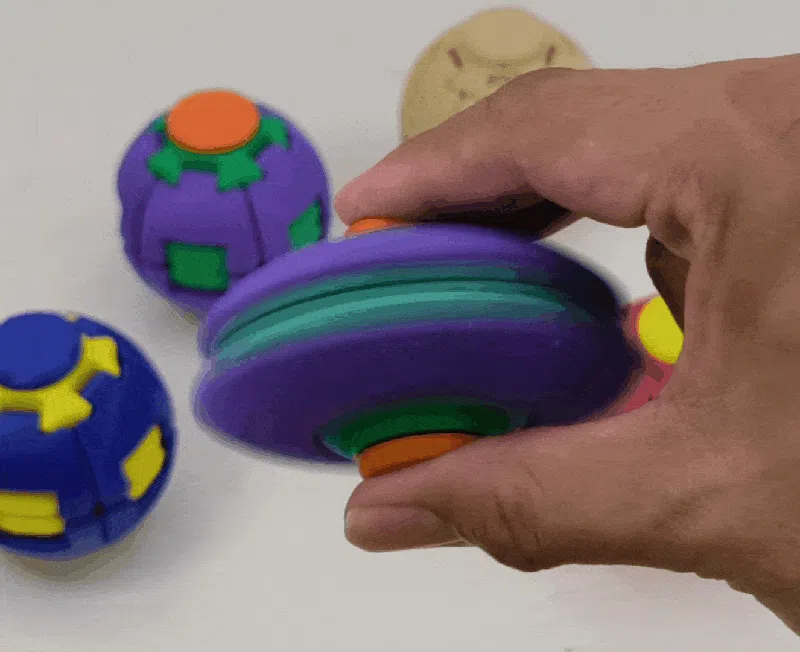 OrbitPop Press and Spin Ball shown open in spinning mode