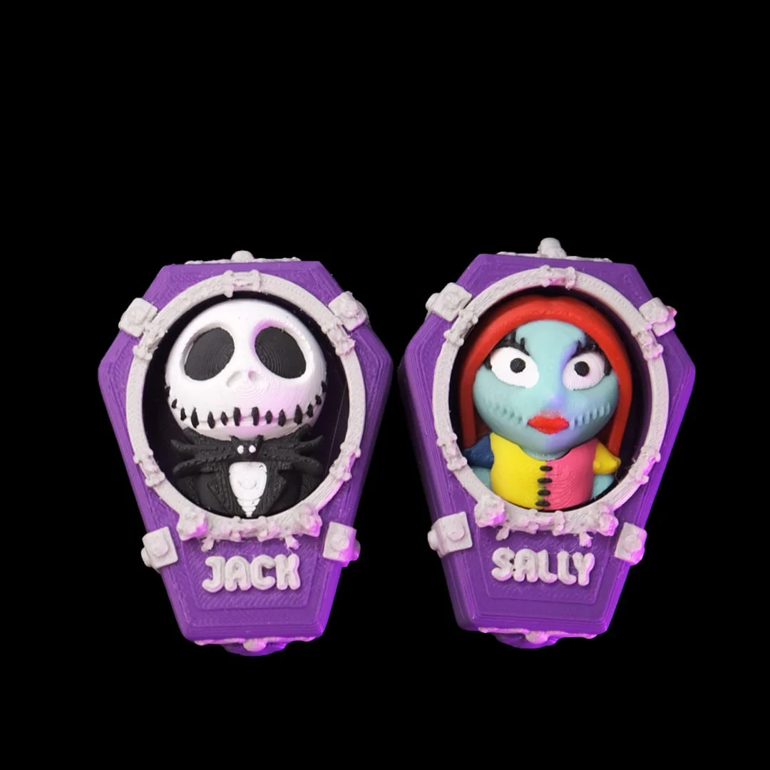 Jack and Sally Skellington coffin clickers side by side, 3D printed by Vivyd