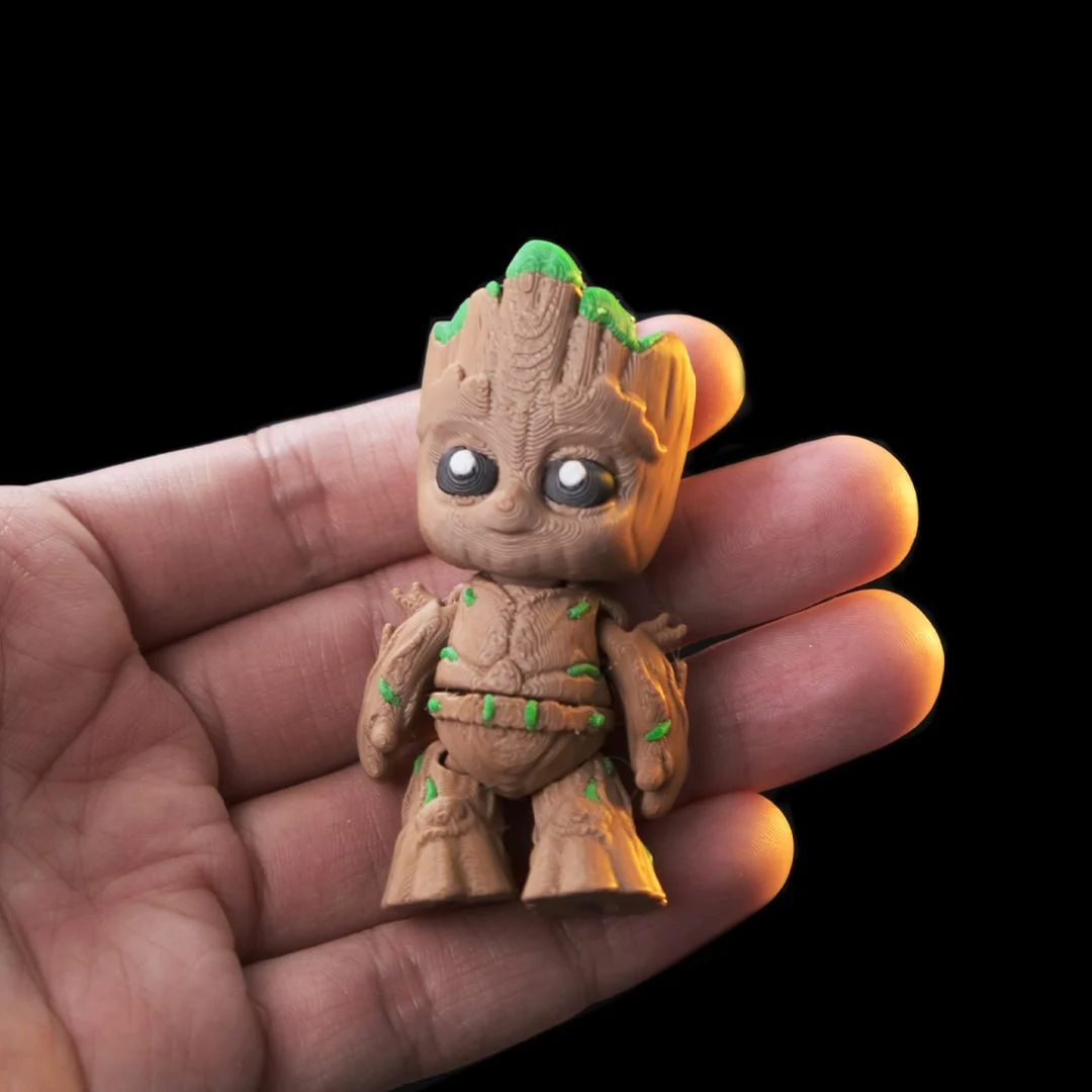 Groot articulated figure held in hand